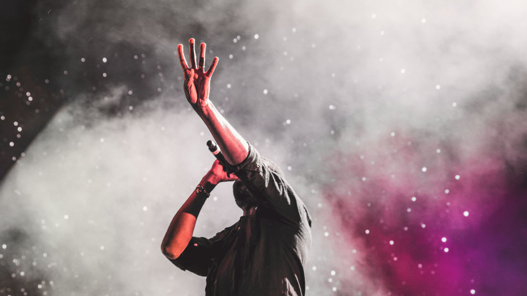 singer holding a mic at a concert